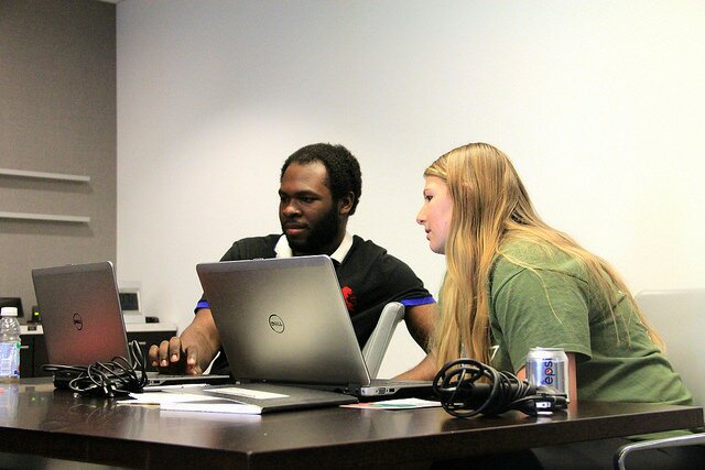 Stef Milovic of the Hidden Valley Nature Lab and Naheem Morris of the Red Hook Digital Stewards program discuss strategy at the Experimental Modes Convening. April 4, 2105. Photo by Dan O'Neil.