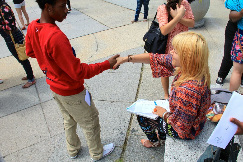 Arts Infusion teaching artist with a teen on the last day of a summer program.