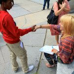 Arts Infusion teaching artist with a teen on the last day of a summer program.